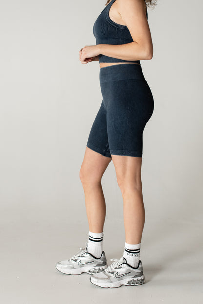 woman wearing high-waisted compression denim bottoms

side view of BASIK Nix shapewear jeans

close-up of tummy control waistband on Nix Bottoms

